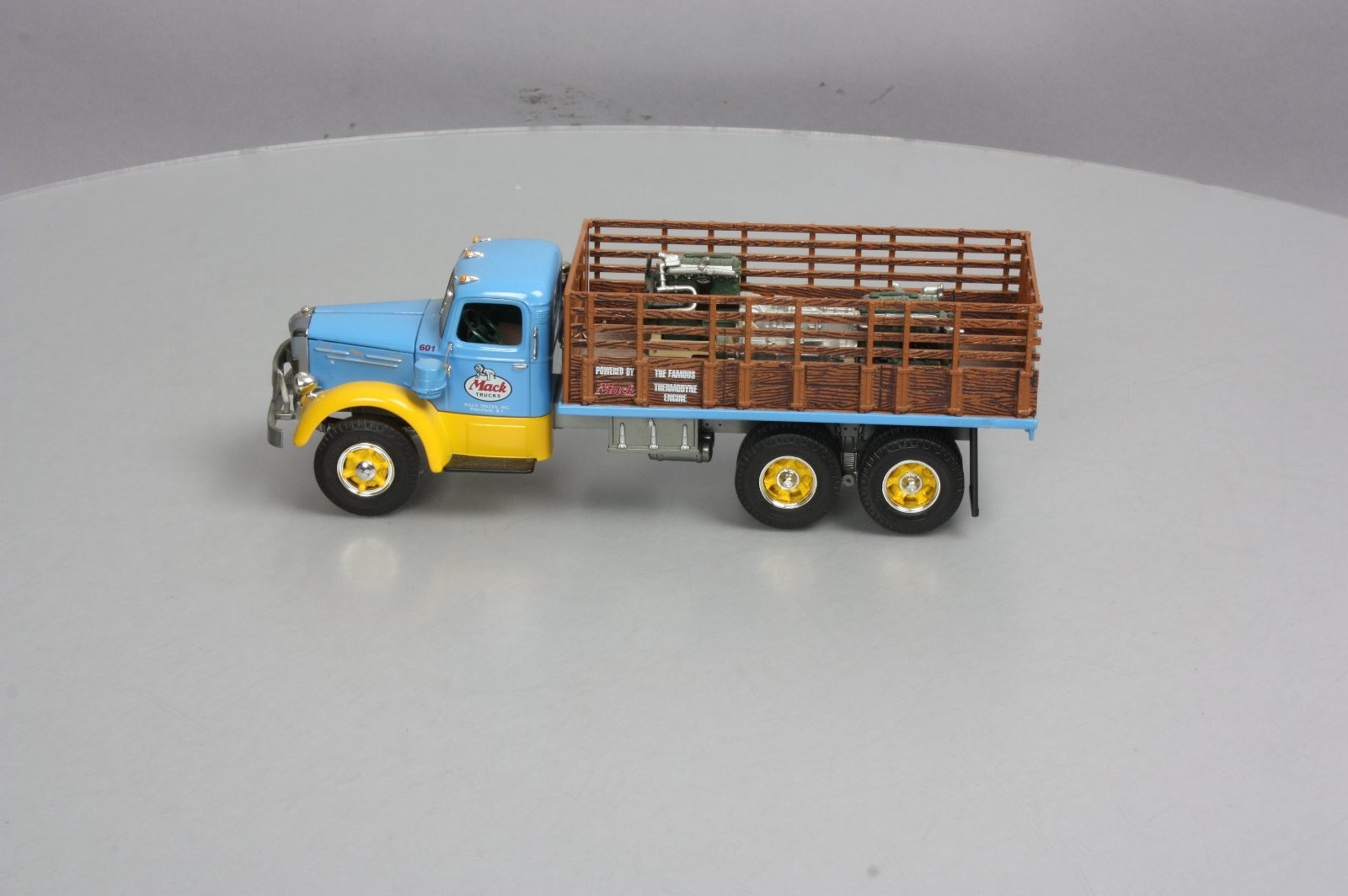 First Gear 19-3155 1:34 Scale Diecast Mack L Series Stake Truck with Engine Load