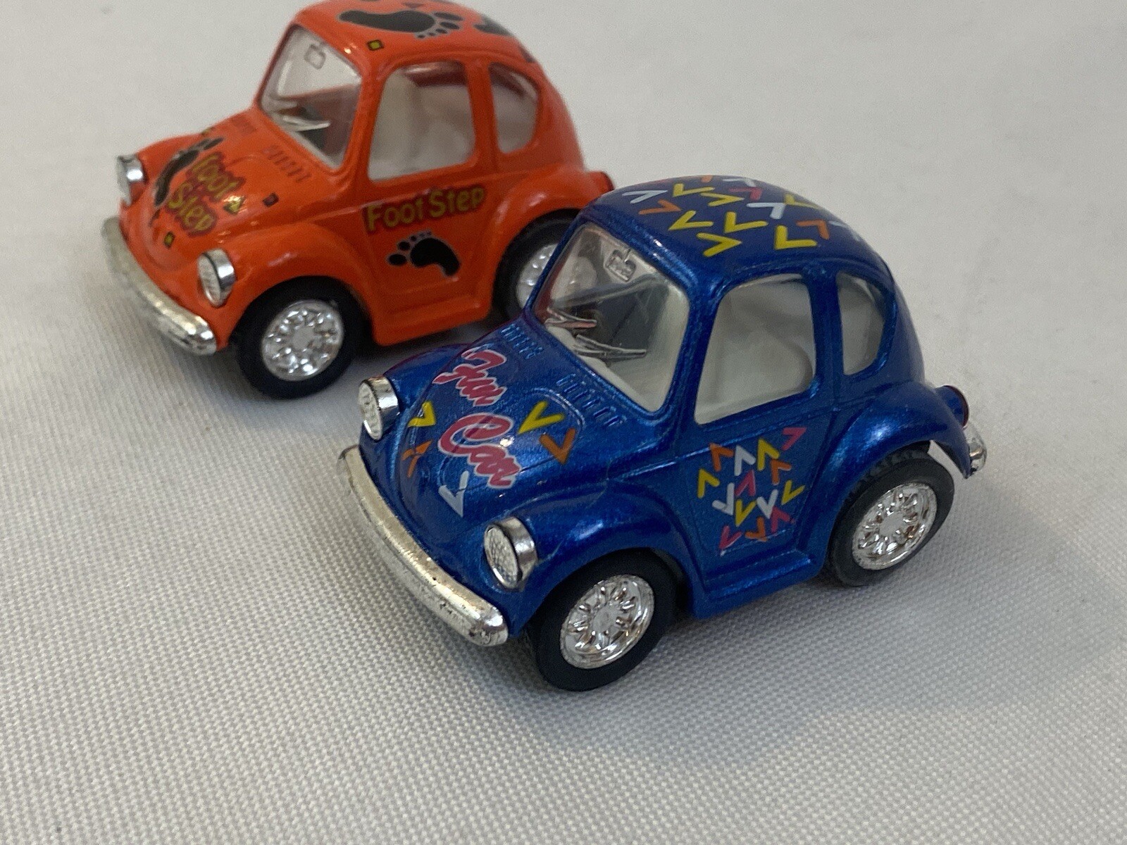 Pair Of Kintoy Pullback Volkswagen Beetles Blue Orange Foot Step Fun Car