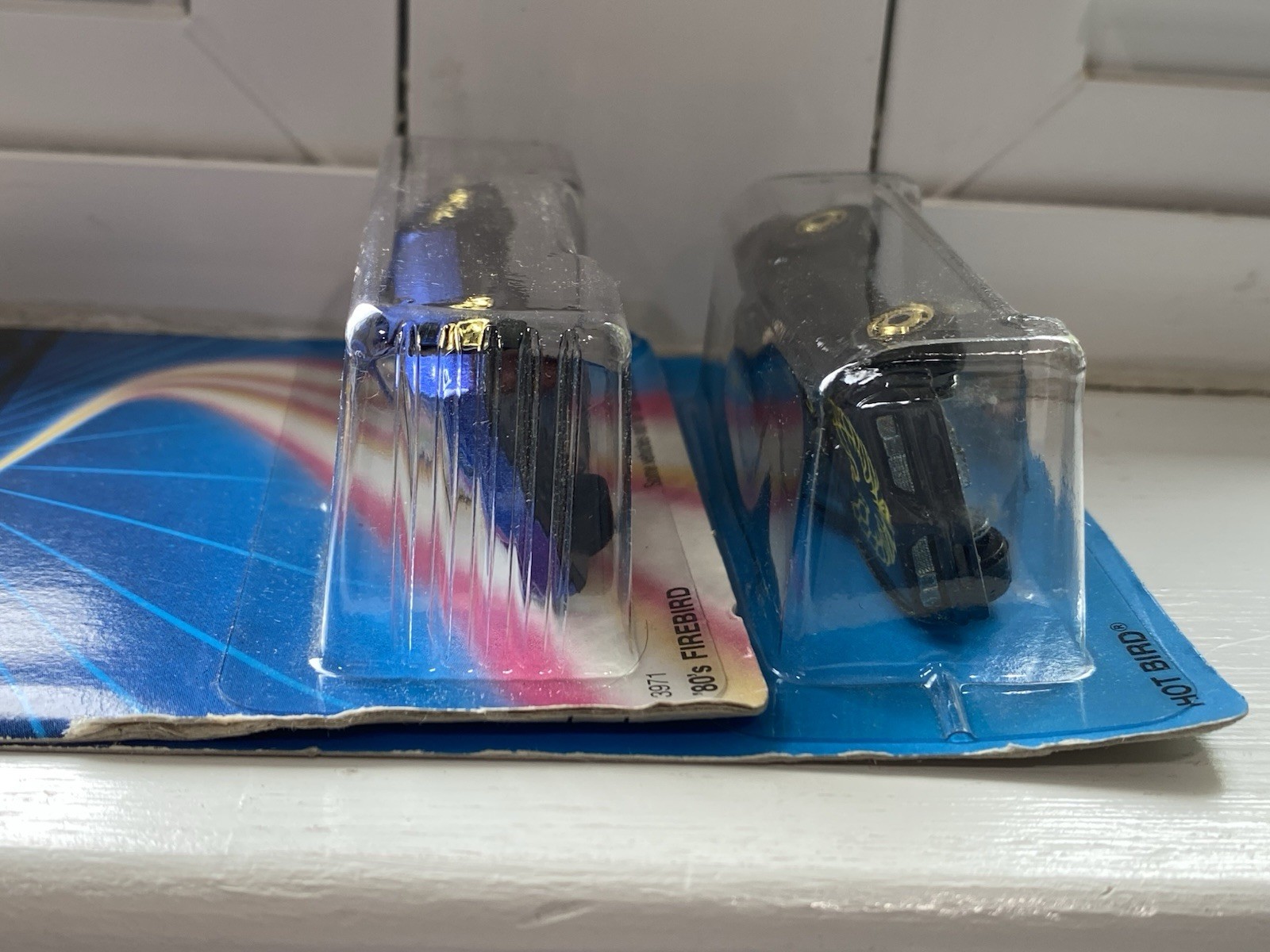 Hot Wheels ’80’s Firebird, Blue and Hot Bird, Black — 2 car set w/gold wheels