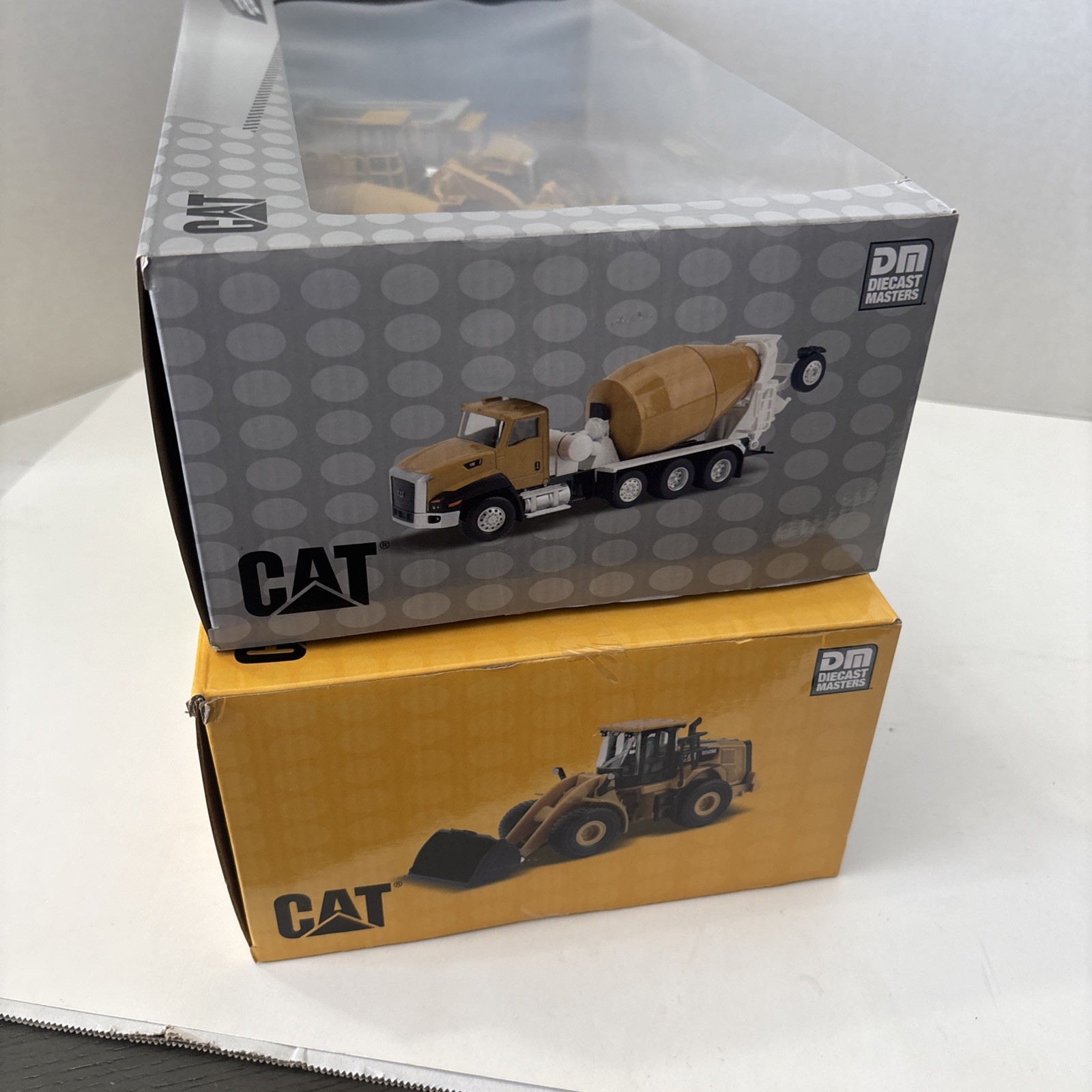 Diecast Masters 1:64 CATERPILLAR Metal Construction Trucks 2 Sets Of 4 – SEALED