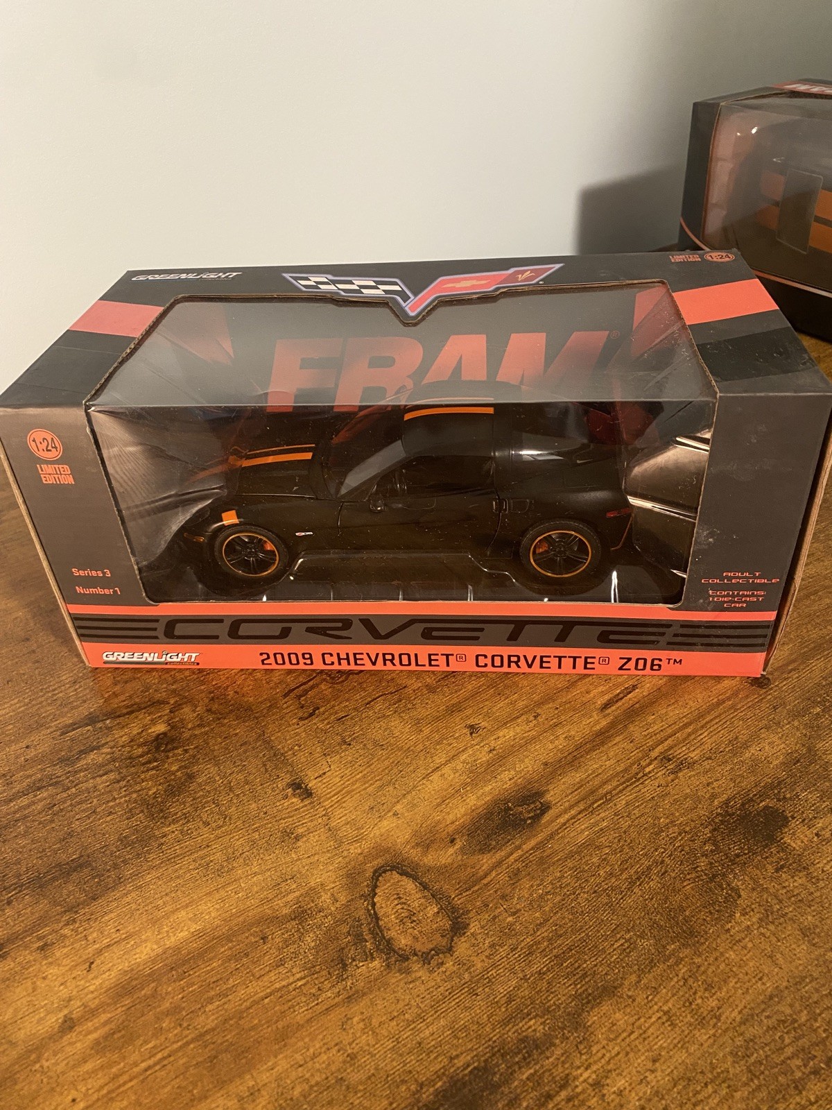 1/24 GREENLIGHT FRAM OIL 2009 CHEVROLET CORVETTE Z06 BLACK W/ORANGE STRIPS