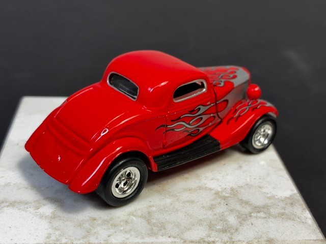 Johnny Lightning ’34 Ford Custom Coupe. 1:64 DIECAST. 2000. Red w/ Silver Flames