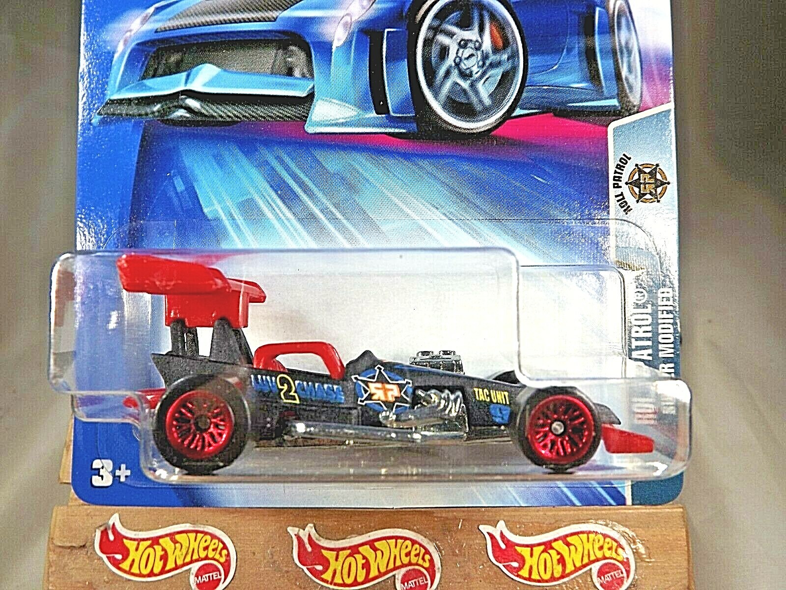 2004 Hot Wheels #189 Roll Patrol SUPER MODIFIED Black w/Red Lace Spoke Wheels