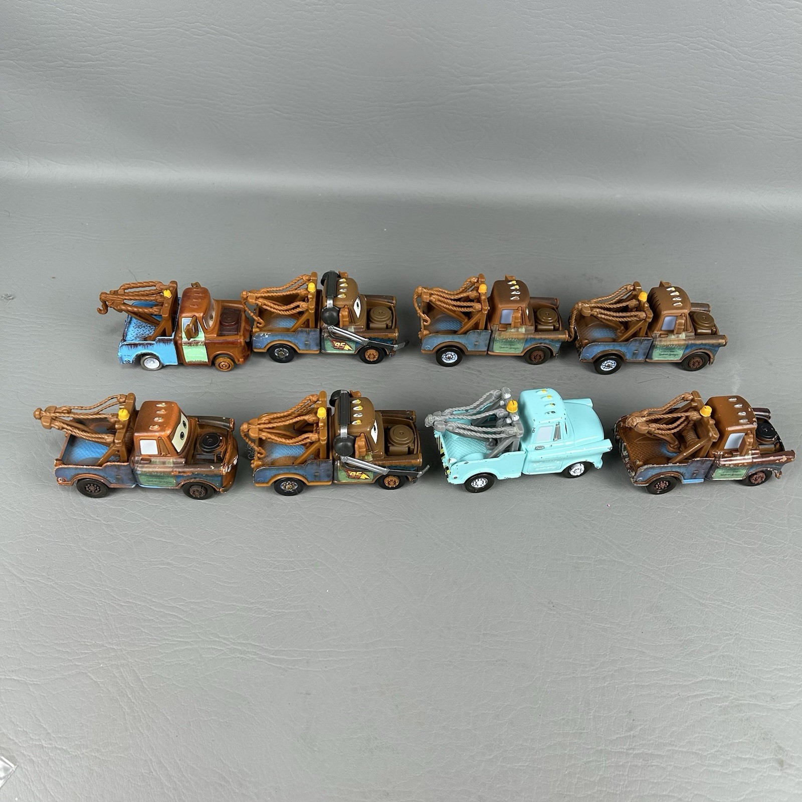 Disney Pixar Cars Diecast Tow Mater Lot of 8 One light blue Different Eyes