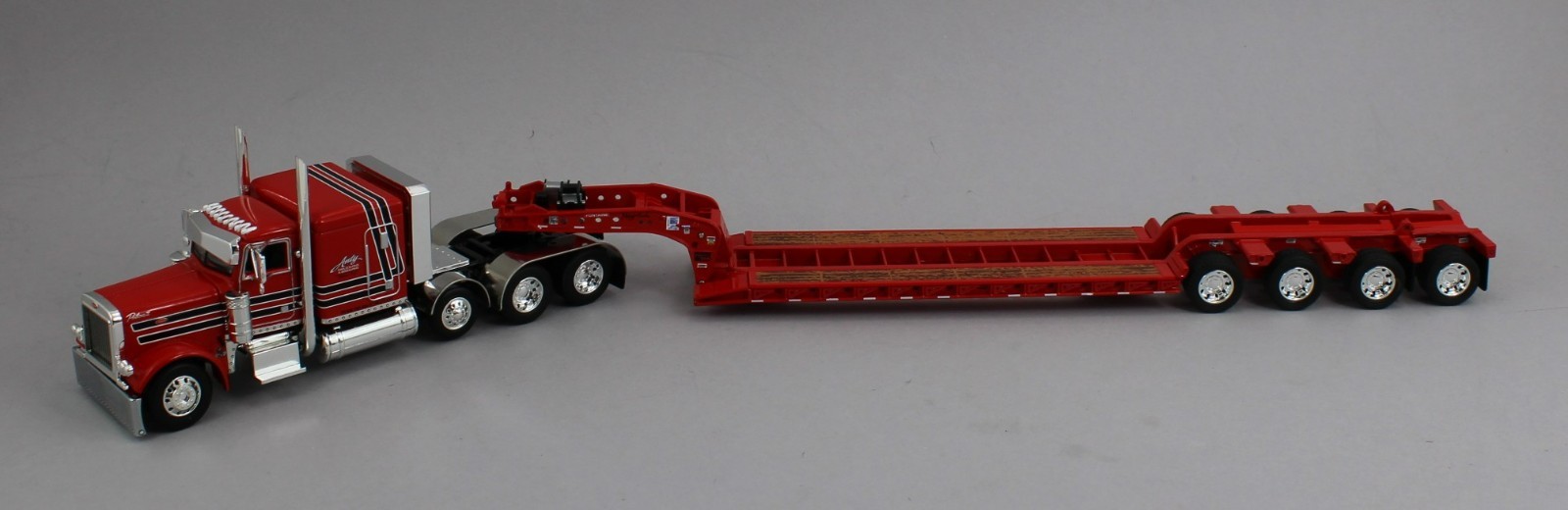 DCP 1:64 *ANTY TRUCKING* Peterbilt 379 63″ Flattop w/Tri-Axle LOWBOY Trailer NIB