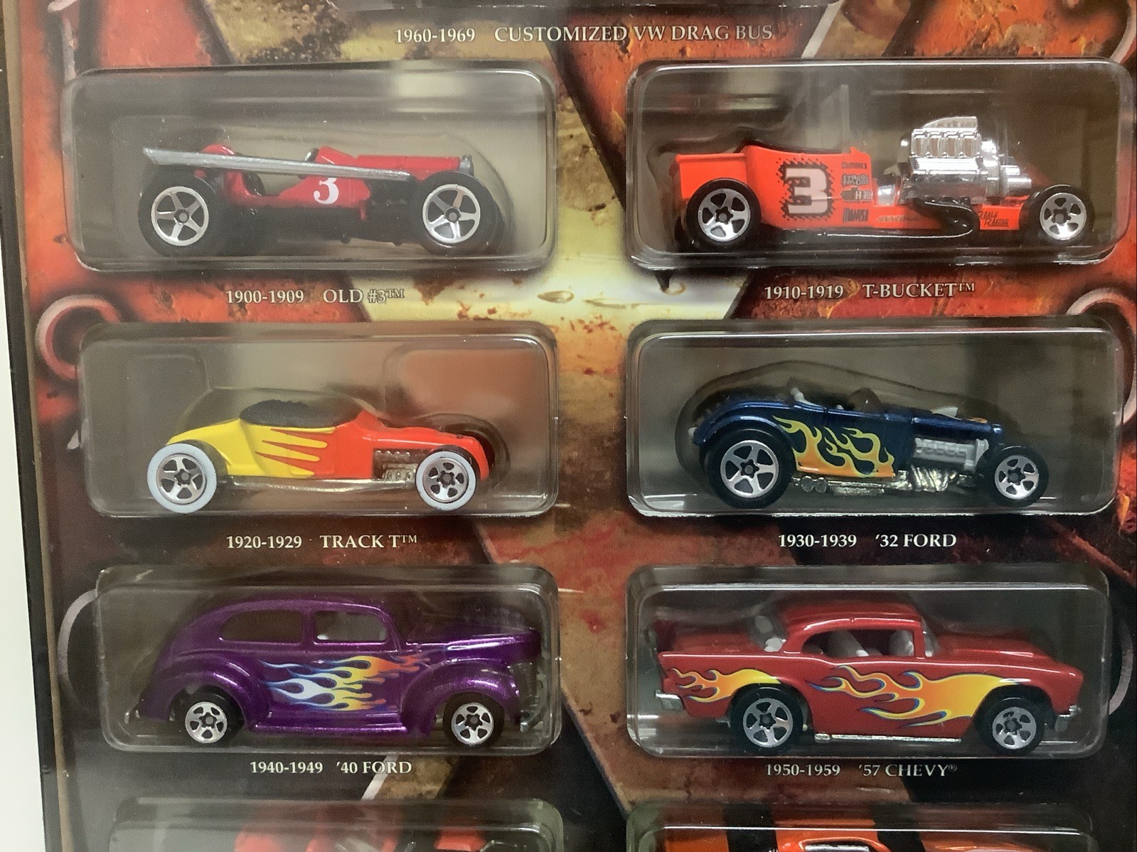 Hot Wheels Decades 1900-2000 Ten Vehicles Cars In Tin with Stand Box