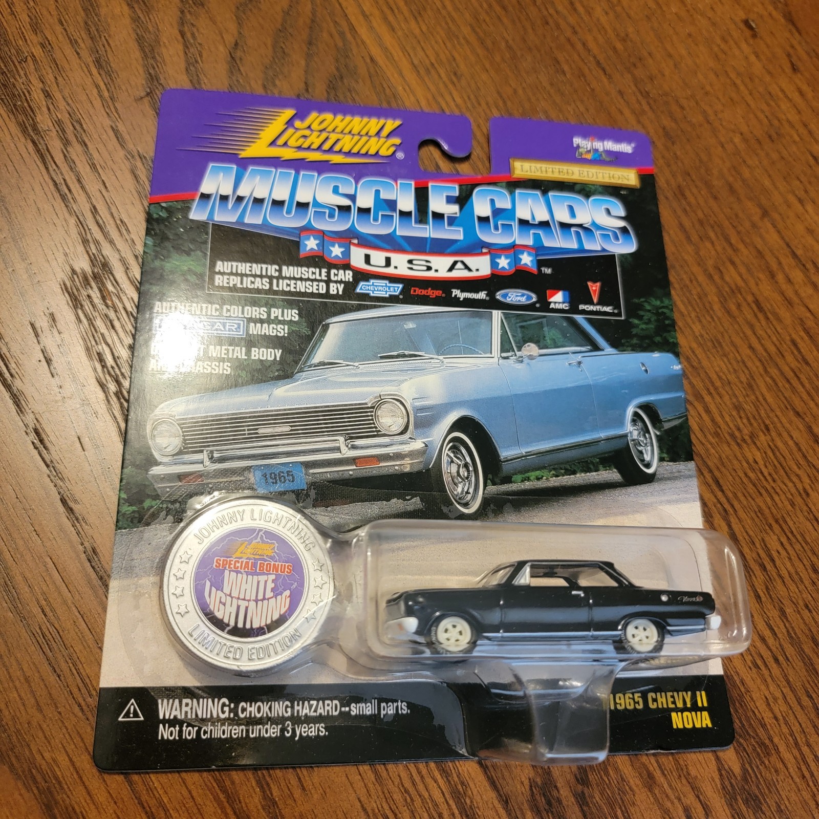 Johnny Lightning 1965 Chevy II Nova Black – 1:64 Diecast White Lighting