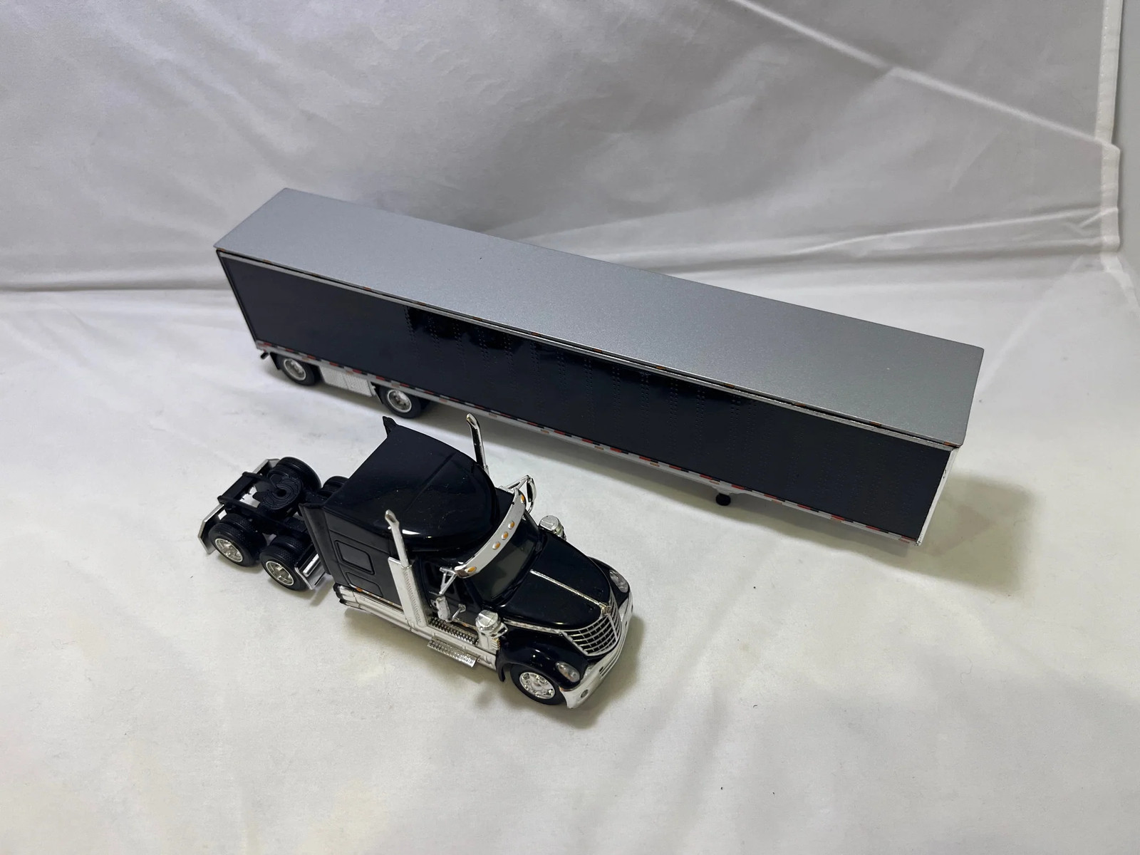 # 01205 – DCP 1:64 Lonestar All Black w/Black Trailer – No Box. – 2 Pcs.