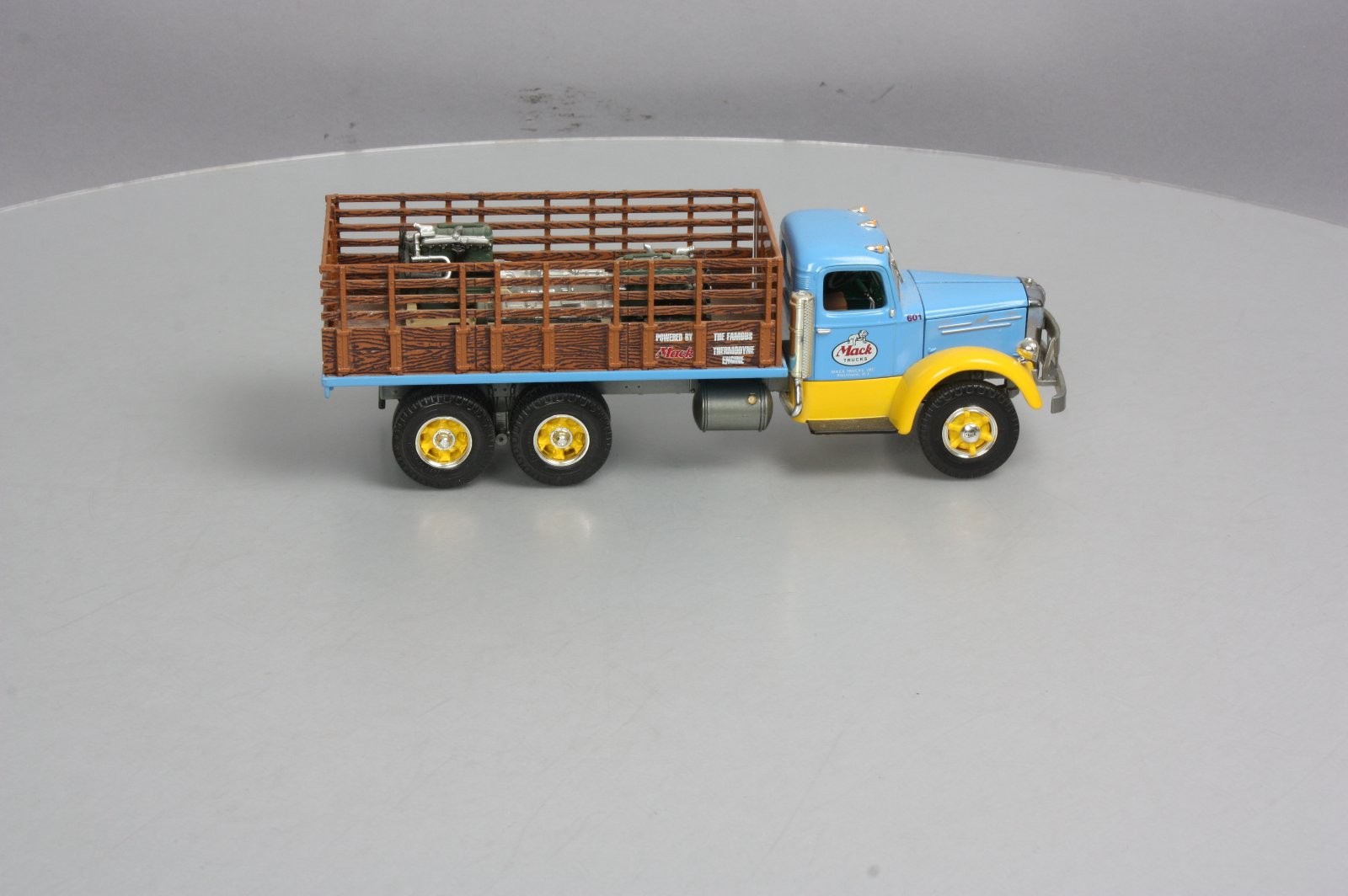 First Gear 19-3155 1:34 Scale Diecast Mack L Series Stake Truck with Engine Load