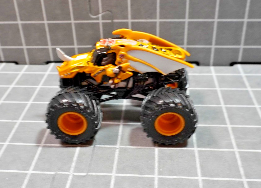 Lot of 4 Hot Wheels including Monster Jam Gears and Galaxies Pirates Curse 1/64