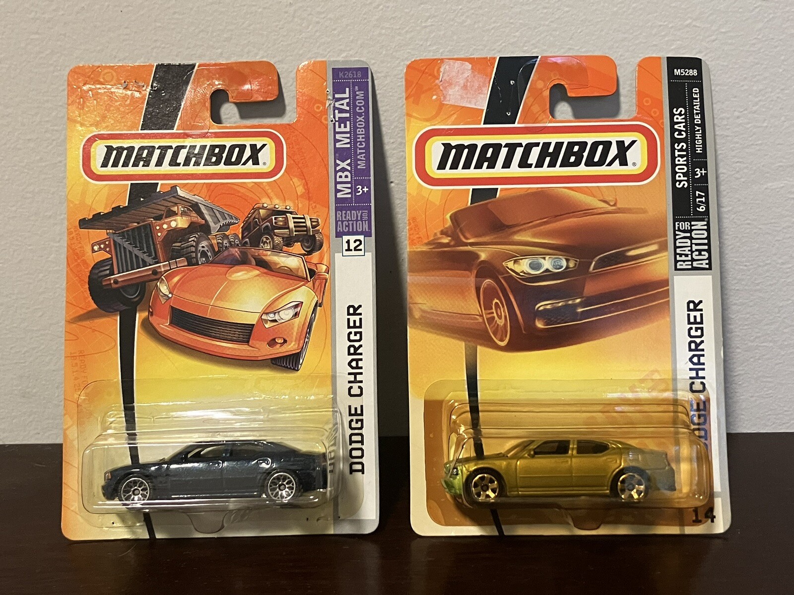 Matchbox 1-75 Dodge Charger Lot Of 2 Dark Blue And Yellow Green Cracked Blister