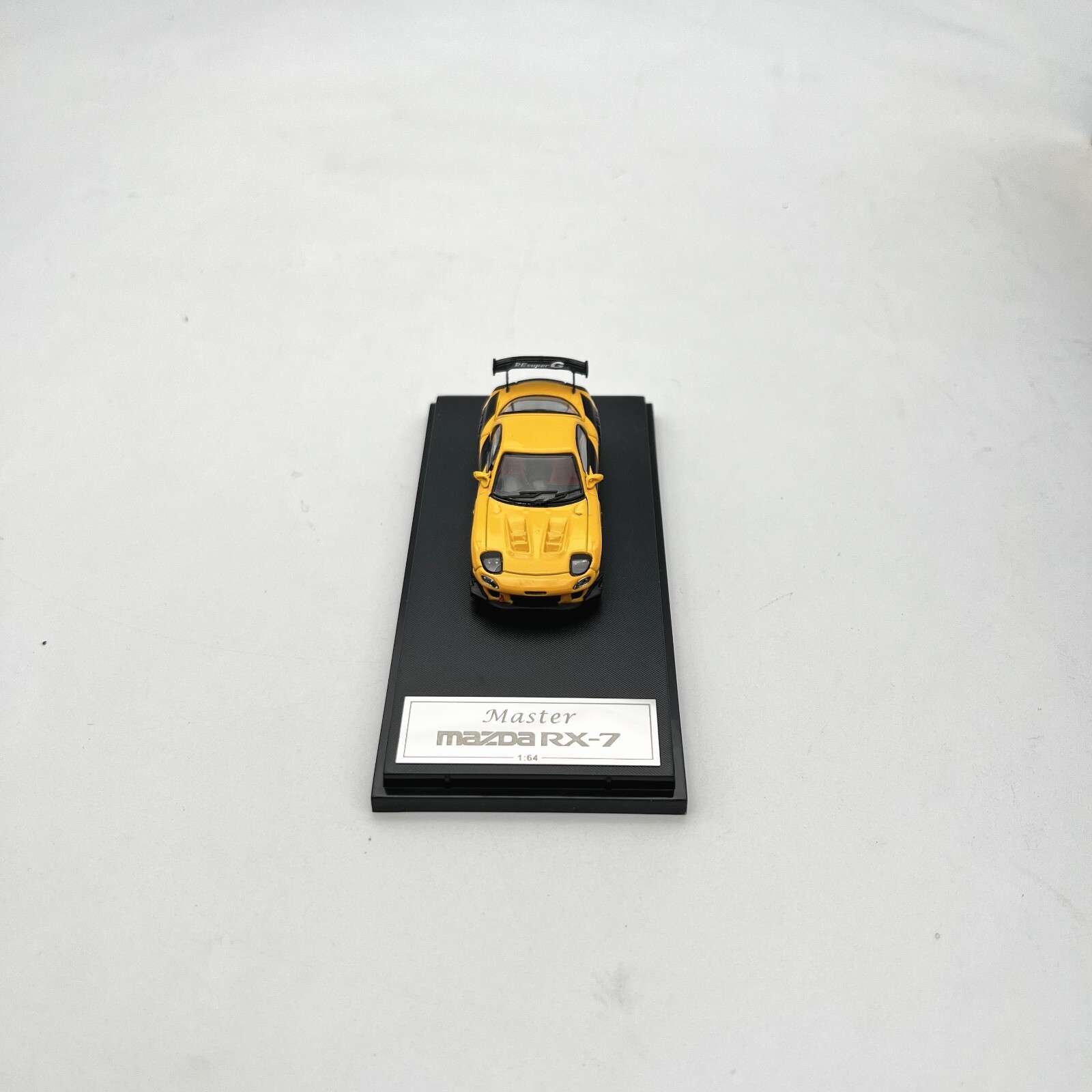 Master 1:64 Mazda RX-7 (Yellow/Black) Diecast Model Car