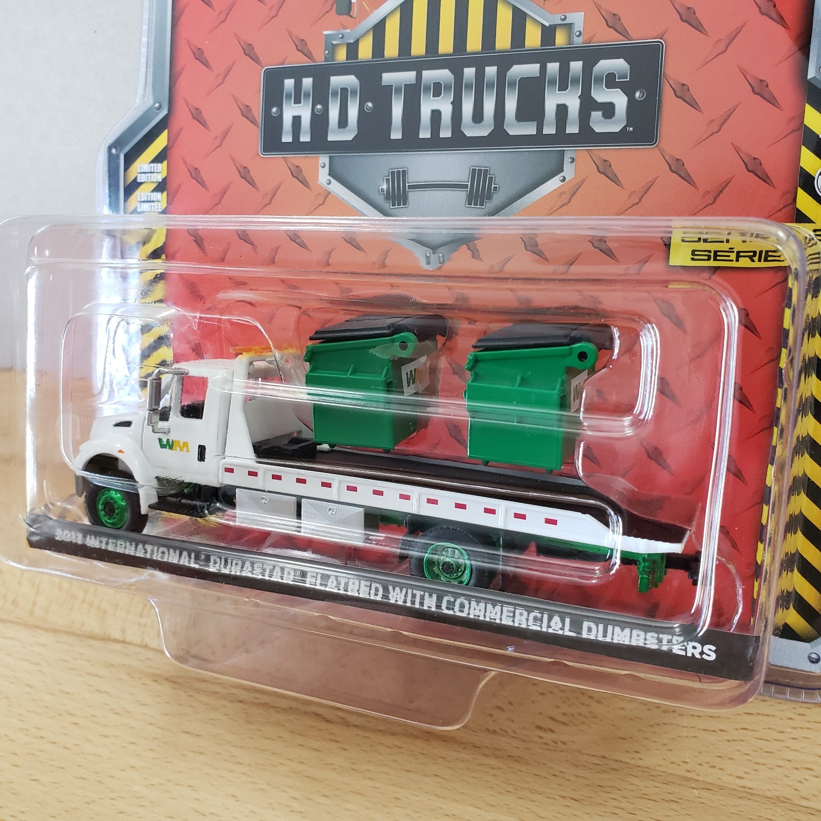 Greenlight 2013 International DuraStar Flatbed with Commercial Dumpsters 1:64