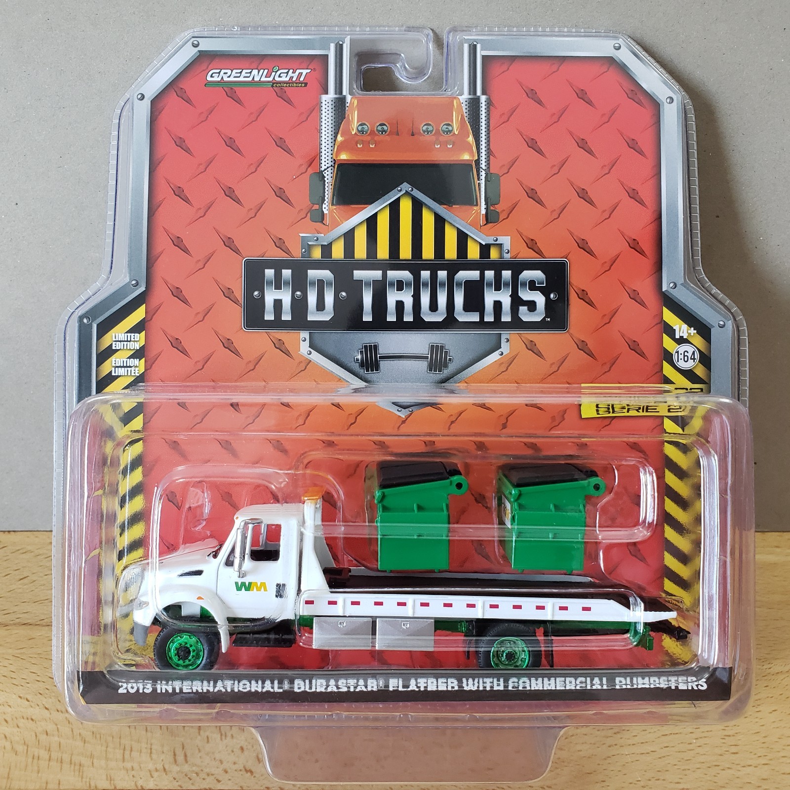 Greenlight 2013 International DuraStar Flatbed with Commercial Dumpsters 1:64