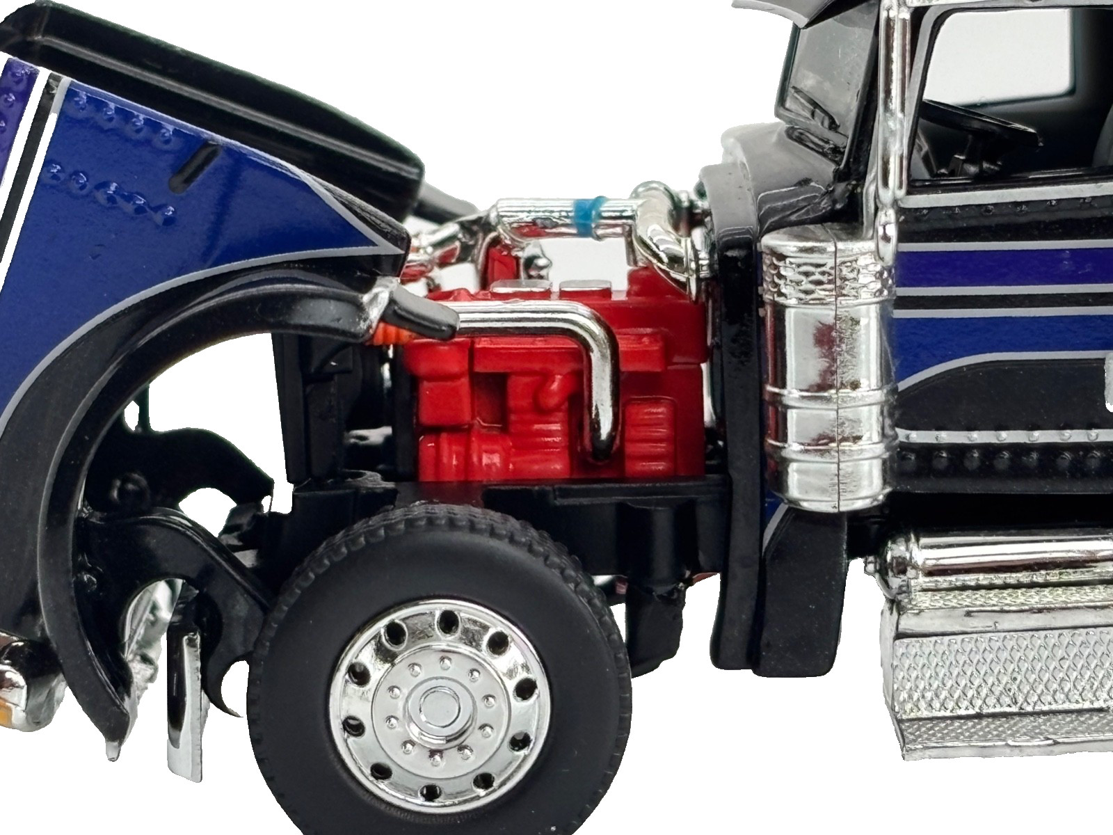 1/64 DCP BLACK/BLUE/SILVER PETERBILT 389 W/ 63″ MID ROOF SLEEPER W/ WHALE TAIL