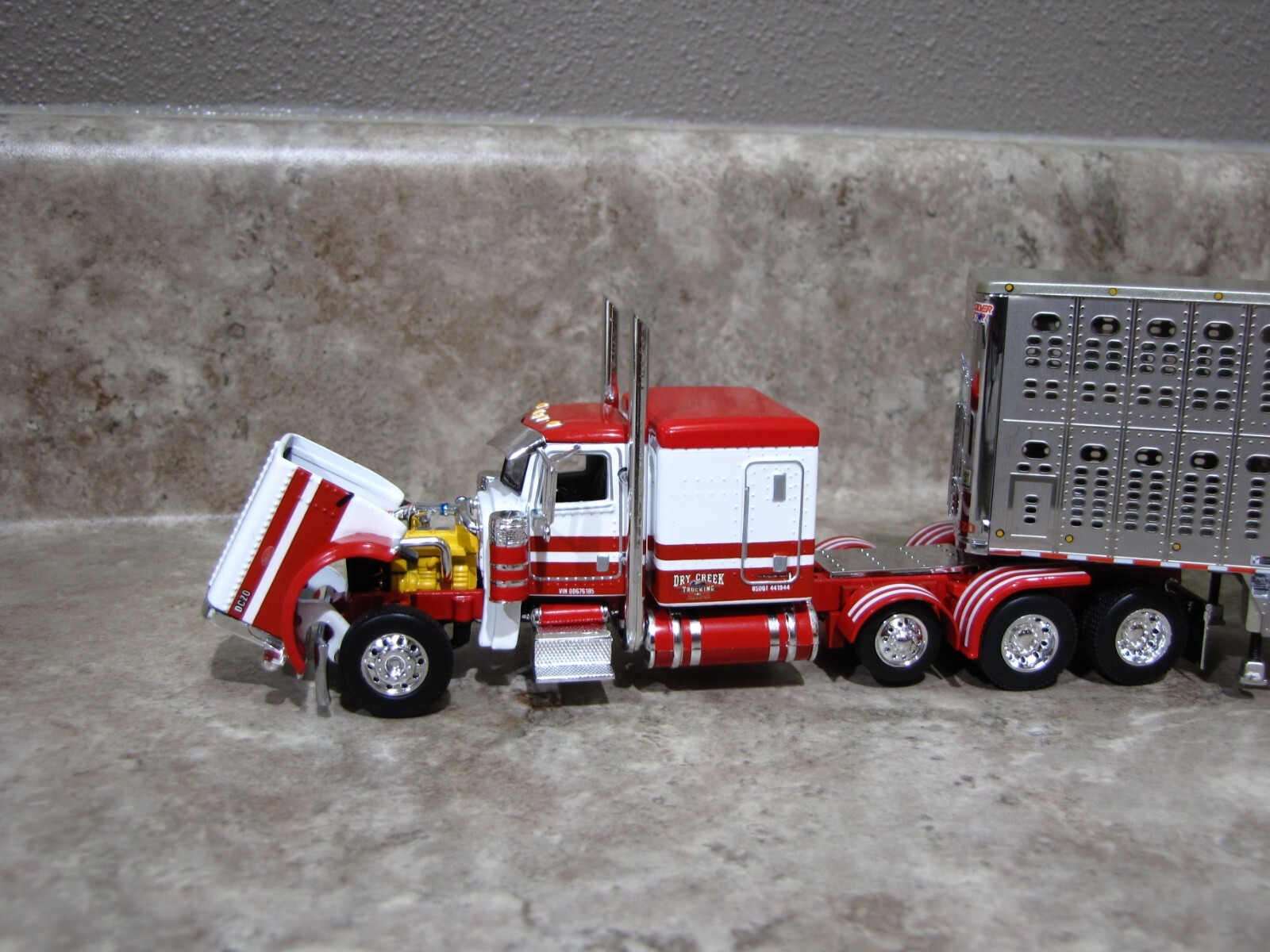 DCP 1/64 Dry Creek Red White Tri-Axle Peterbilt 389 Wilson Livestock 60-1050