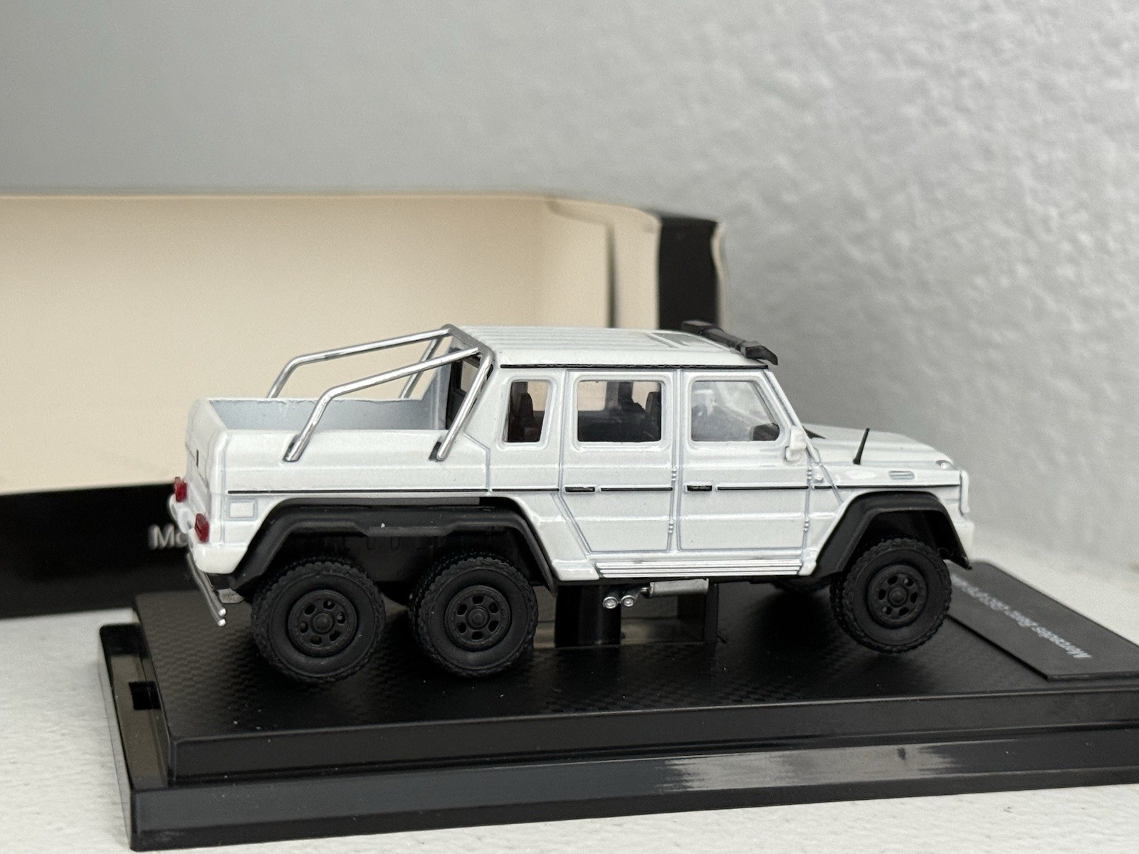 China 1:64 unbranded diecast Mercedes Benz G63 AMG 6×6 in white; premium model