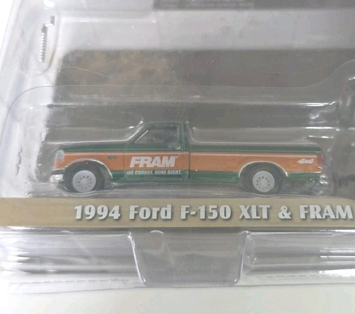 Greenlight Chase 1994 Ford F-150 XLT & Fram Oil Filters Enclosed Car Trailer